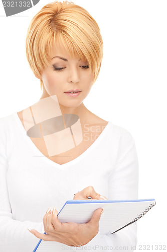 Image of attractive businesswoman with notebook