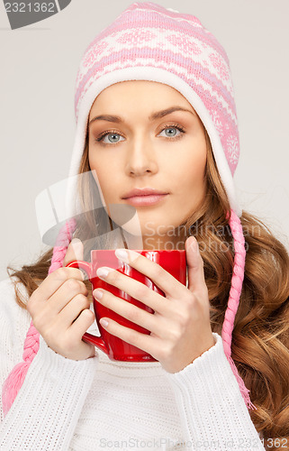 Image of beautiful woman with red mug