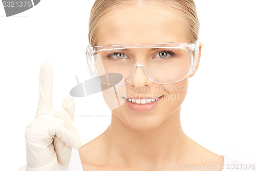 Image of woman in protective glasses and gloves