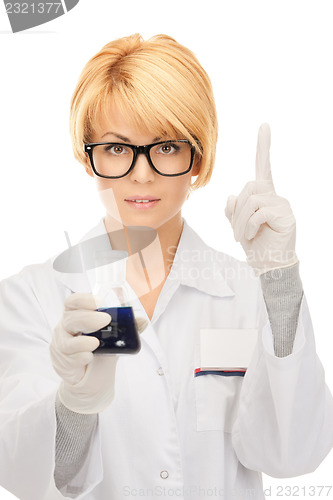 Image of lab worker holding up test tube