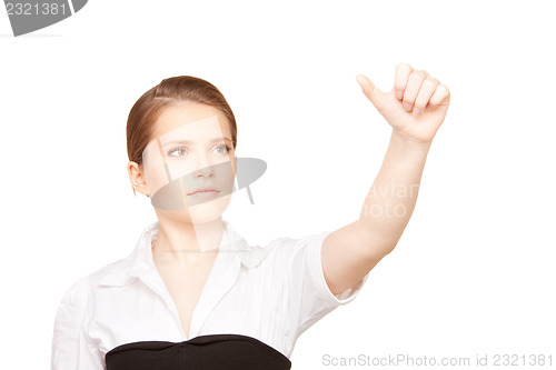 Image of businesswoman working with something imaginary