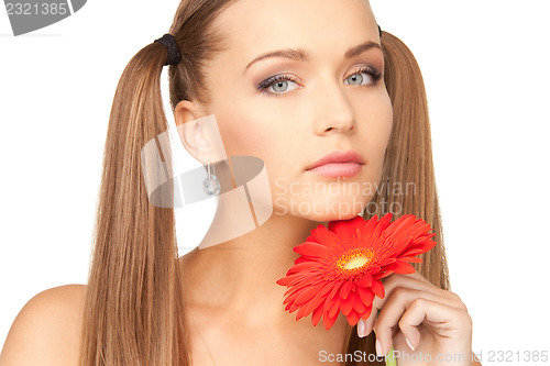 Image of lovely woman with red flower