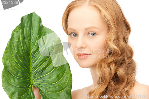 Image of woman with green leaf