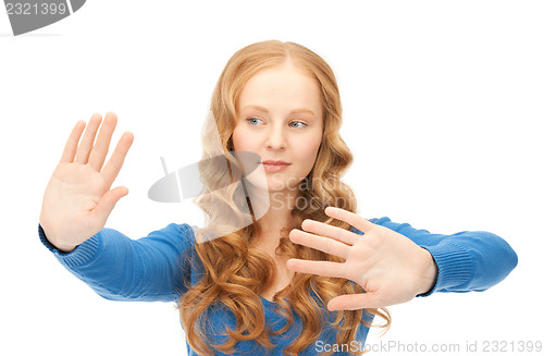 Image of businesswoman working with something imaginary