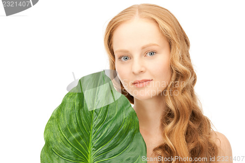 Image of woman with green leaf