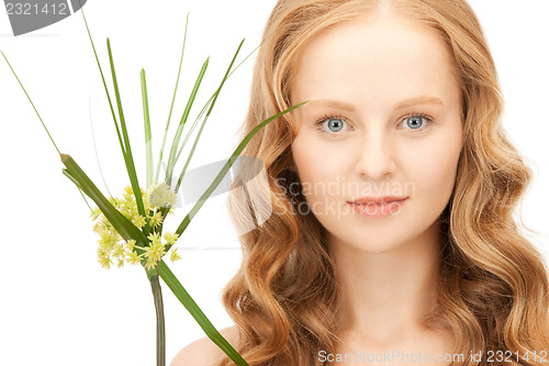 Image of woman with green sprout