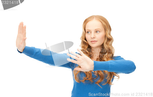 Image of businesswoman working with something imaginary