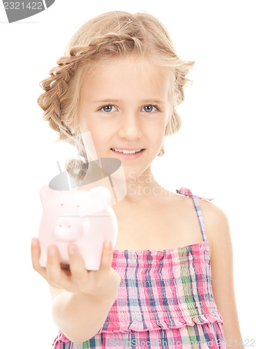 Image of little girl with piggy bank