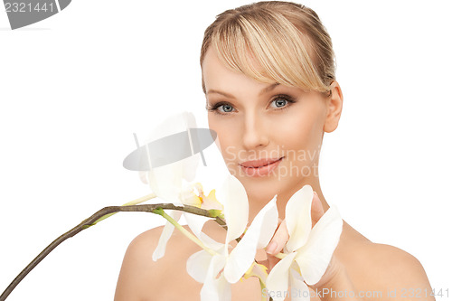 Image of beautiful woman with orchid flower 