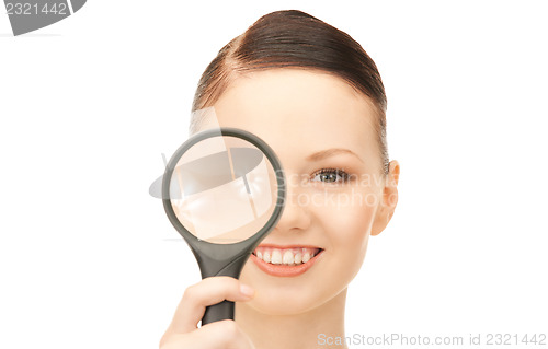 Image of  woman with magnifying glass	 