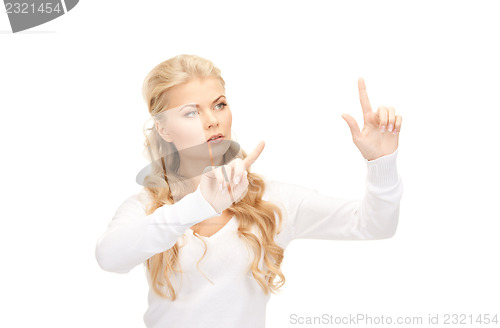 Image of businesswoman working with something imaginary
