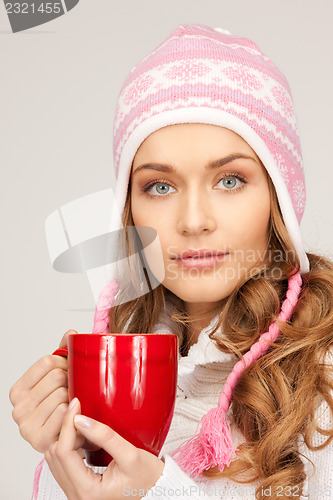 Image of beautiful woman with red mug