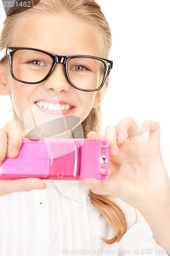 Image of happy girl taking picture with cell phone