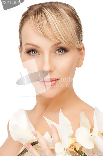 Image of beautiful woman with orchid flower 