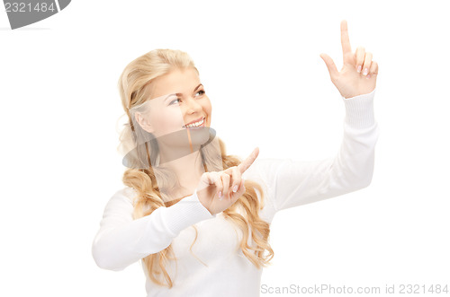 Image of businesswoman working with something imaginary
