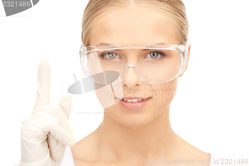 Image of woman in protective glasses and gloves