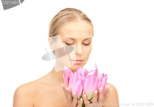 Image of beautiful woman with lotus flower
