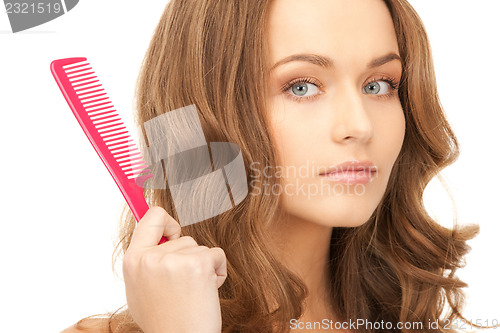 Image of beautiful woman with comb