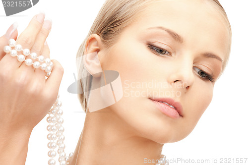Image of beautiful woman with pearl beads