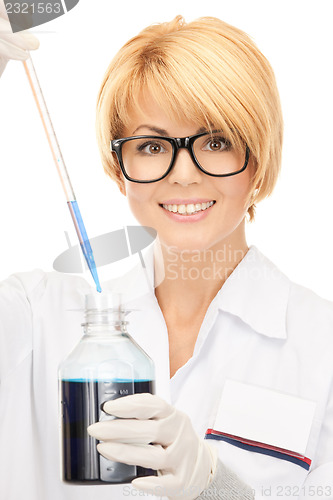 Image of lab worker holding up test tube