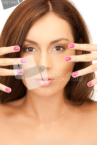 Image of lovely woman with polished nails 