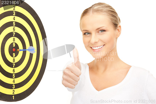 Image of businesswoman with dart and target