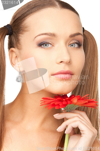 Image of lovely woman with red flower