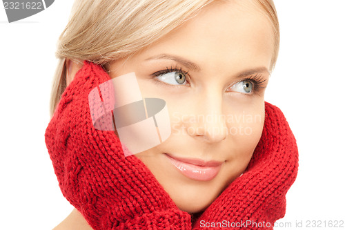 Image of beautiful woman in red mittens