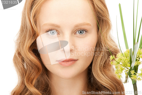 Image of woman with green sprout