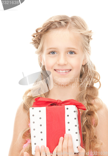 Image of happy little girl with gift box