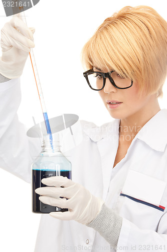 Image of lab worker holding up test tube