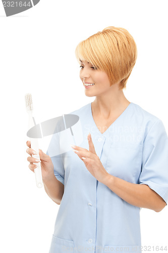 Image of doctor with toothbrush