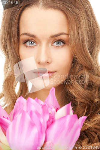 Image of beautiful woman with lotus flower