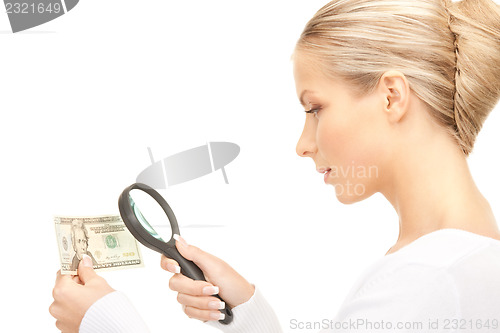 Image of woman with magnifying glass and money