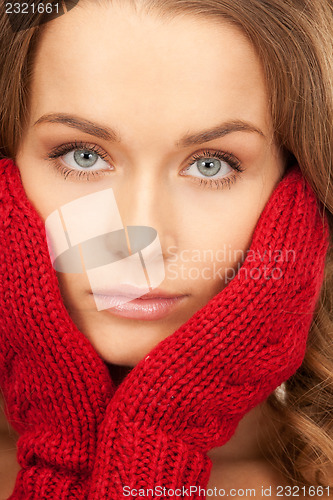 Image of beautiful woman in red mittens