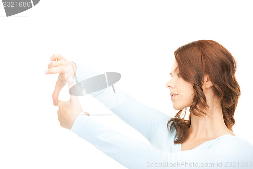 Image of lovely woman creating a frame with fingers