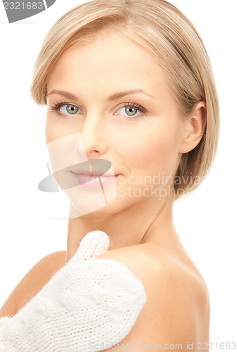 Image of beautiful woman in white mittens