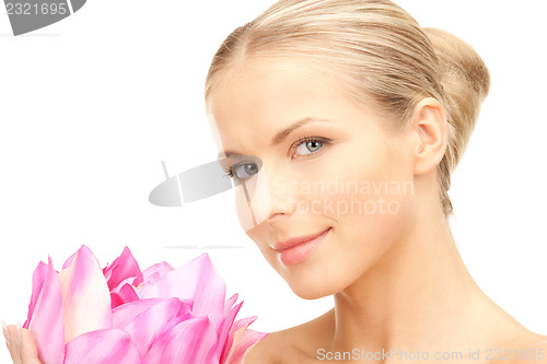 Image of beautiful woman with lotus flower