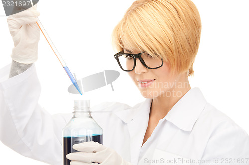 Image of lab worker holding up test tube