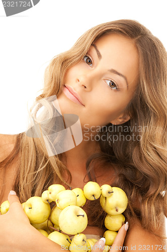 Image of lovely woman with green apples