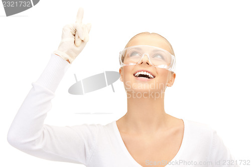 Image of woman in protective glasses and gloves