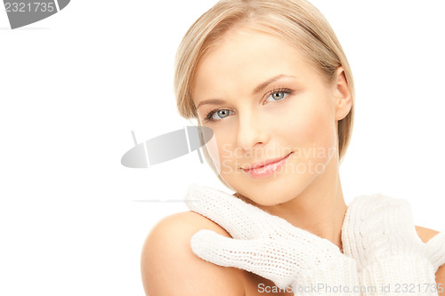 Image of beautiful woman in white mittens