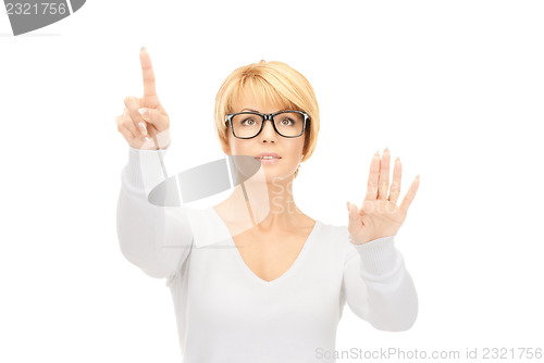 Image of businesswoman working with something imaginary 