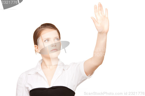 Image of businesswoman working with something imaginary