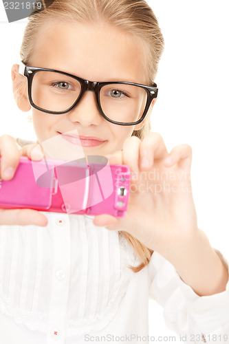 Image of happy girl taking picture with cell phone