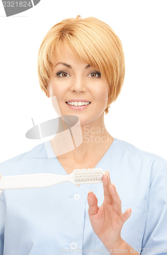 Image of doctor with toothbrush