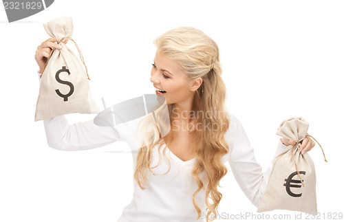 Image of woman with euro and dollar bags