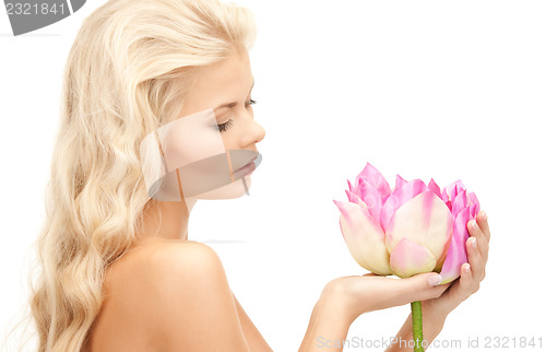 Image of beautiful woman with lotus flower