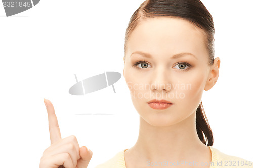 Image of  woman with her finger up	 