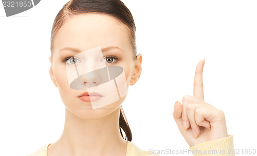 Image of  woman with her finger up	 